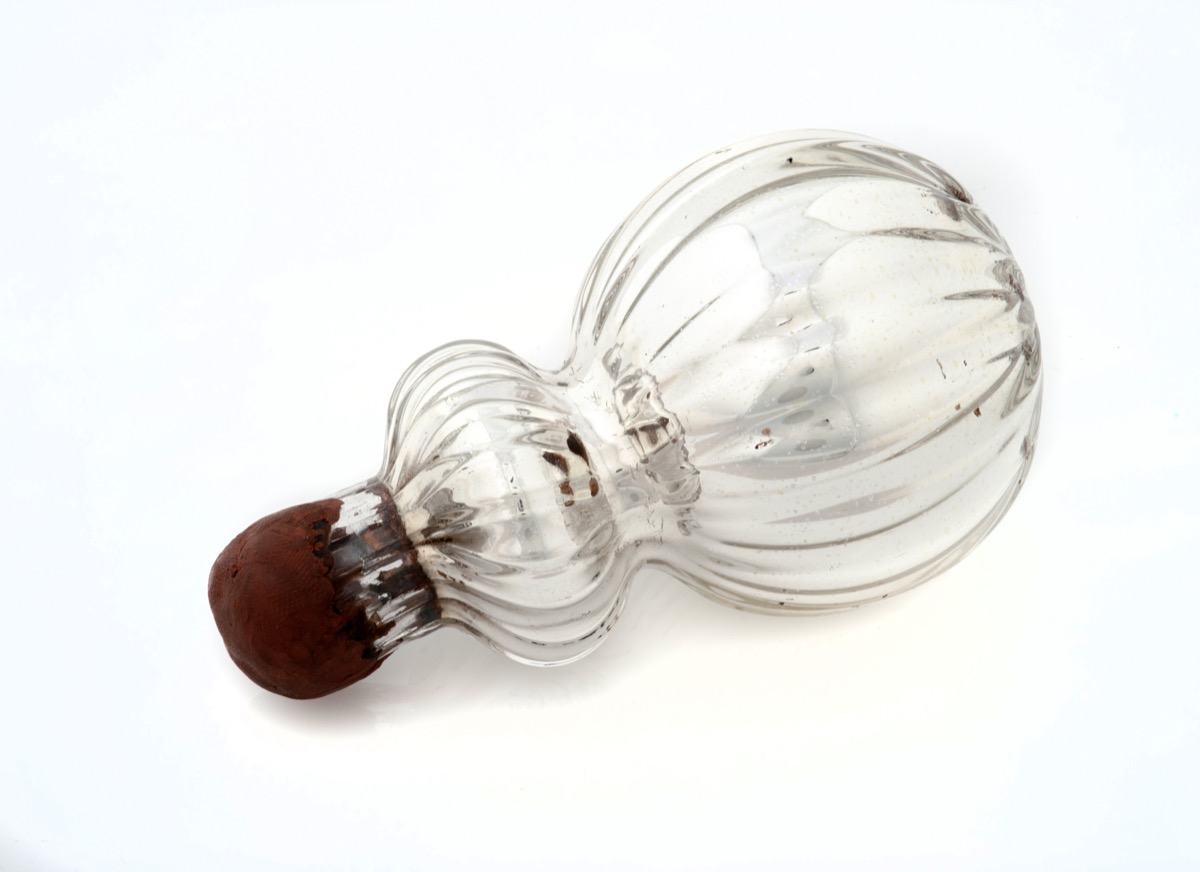 White fluted glass flask with wax stopper